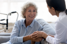 senior woman with caregiver during a wellness screening
