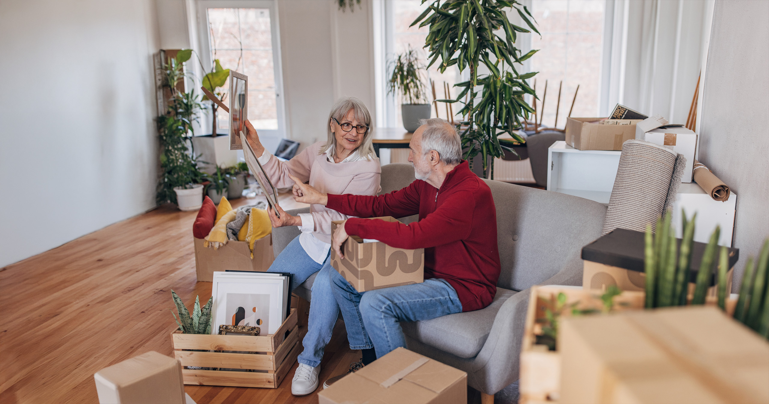 An older couple sorting through valuables while downsizing to move